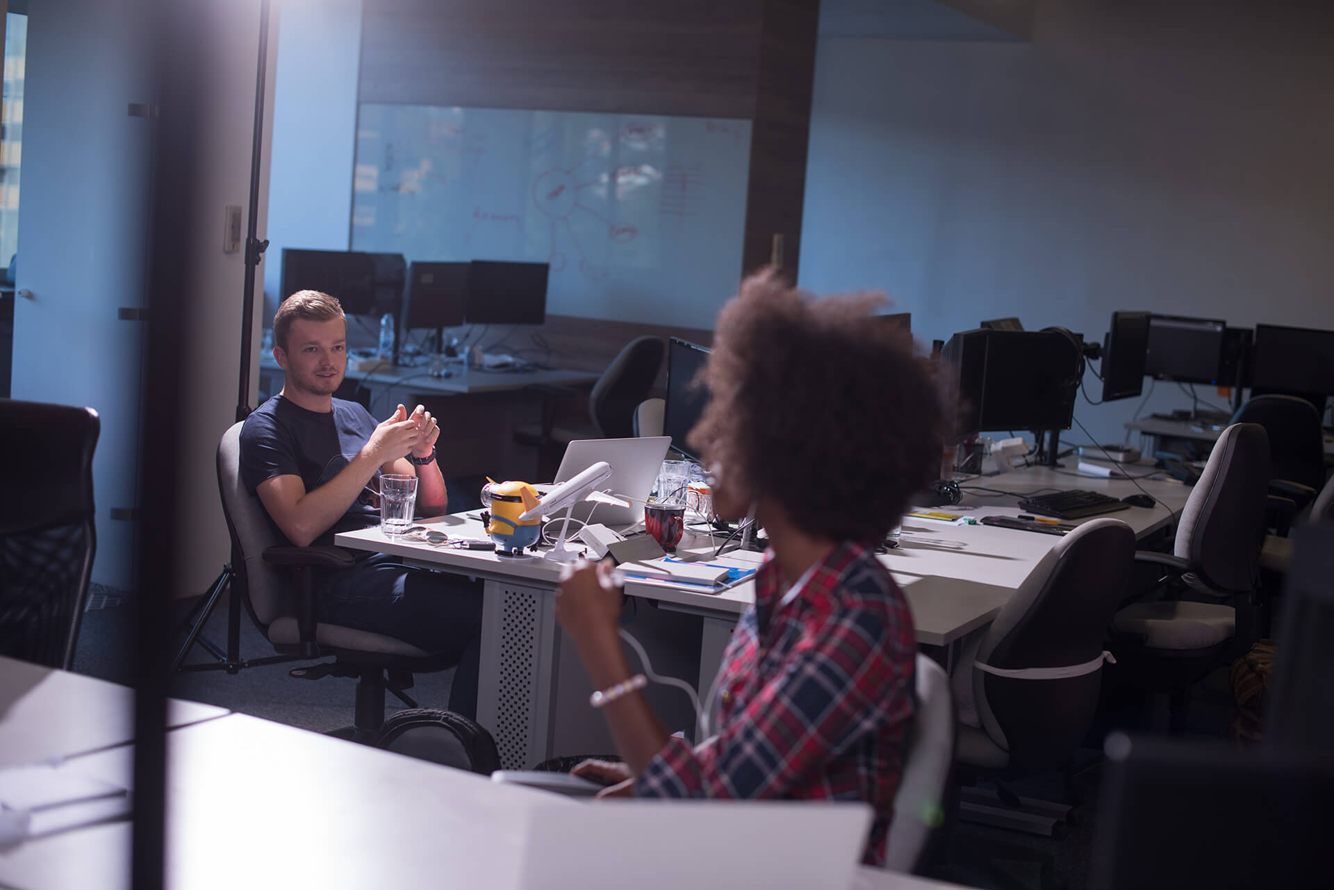Students Talking In Work Space
